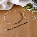 Silver anklet with black beads