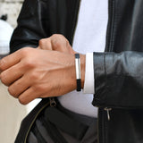 Silver bracelet with black starp