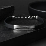 Silver bracelet with black starp