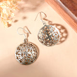 Round Carved silver earrings